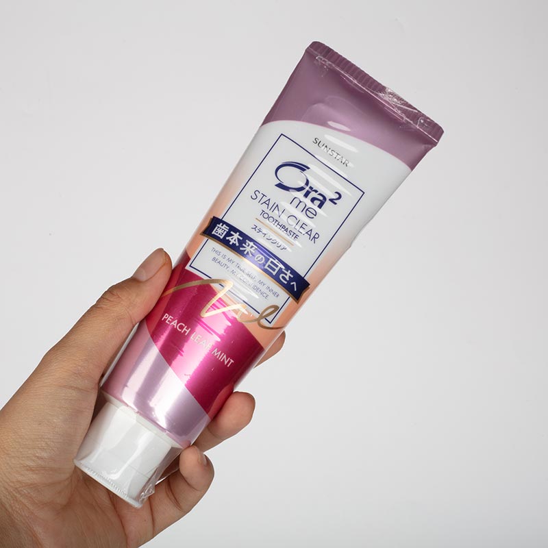 Kem đánh răng Nhật Bản Ora2 me Stain Clear hương bạc hà lá đào 140g, Răng trắng bóng, hơi thở thơm mát thương hiệu SUNSTAR